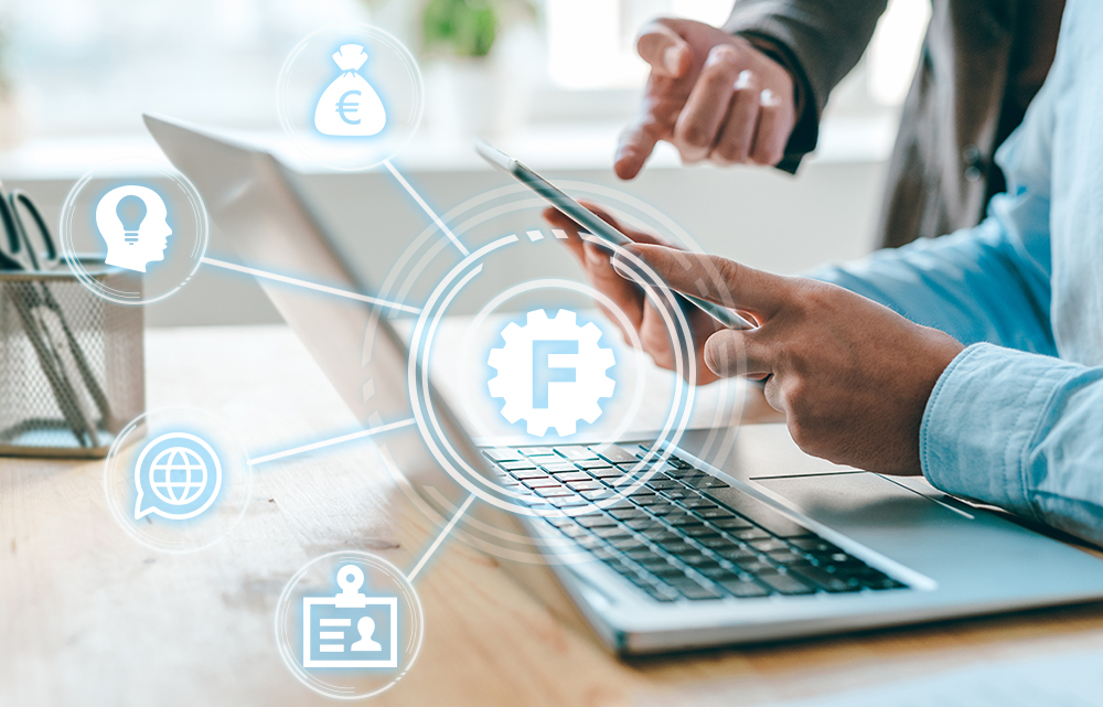 Business man pointing at mobile gadget held by his colleague with hologram icons on top of it