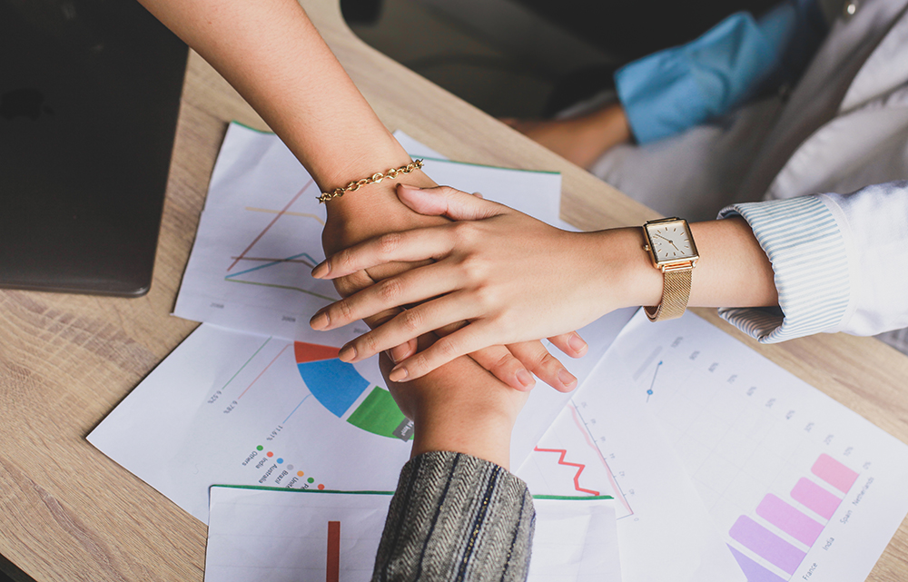 business team touching hands together